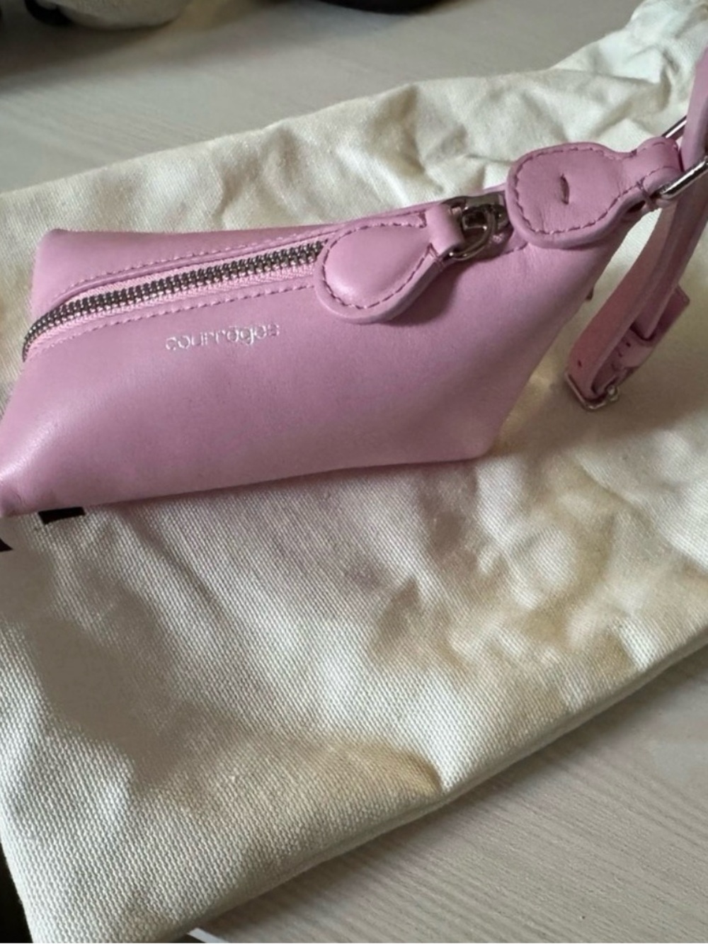 Purple Clutch with Silver Logo Accent.